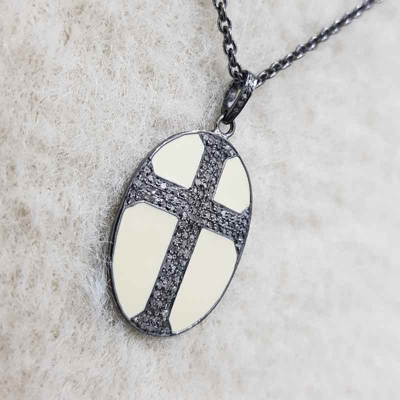 Oval Shaped Pave Diamond Cross Style Pendent With Cream Enamel