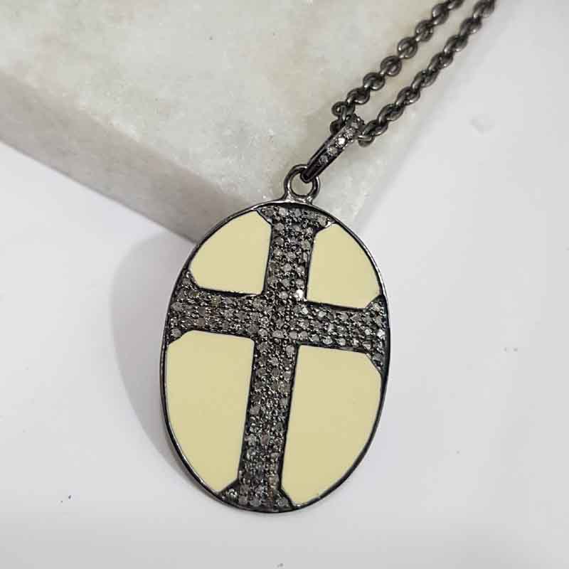 Oval Shaped Pave Diamond Cross Style Pendent With Cream Enamel