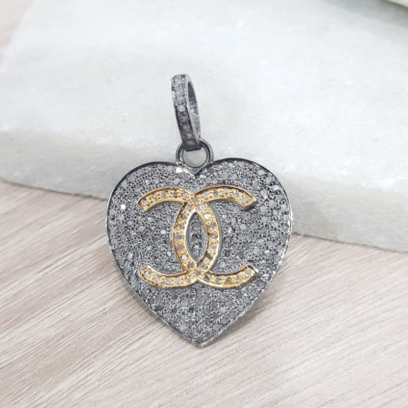 Beautiful Two Tone Heart Pendant With CC Twist