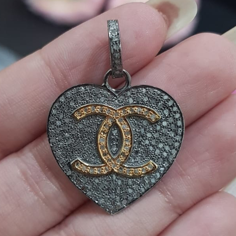 Beautiful Two Tone Heart Pendant With CC Twist