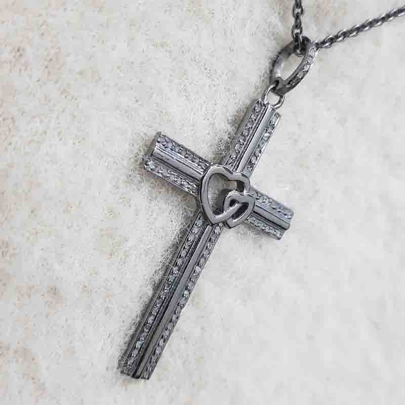 Beautifully Designed Cross Pendent With Little Joined Heart In Center